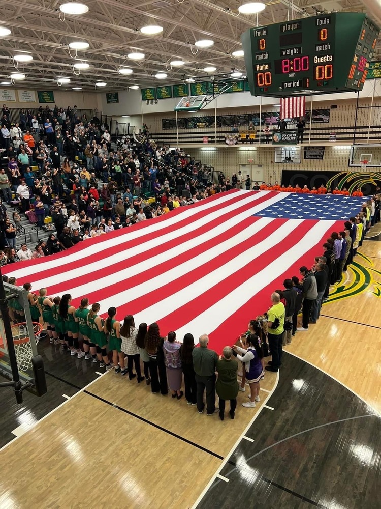 Tournament Workers Presenting the Flag